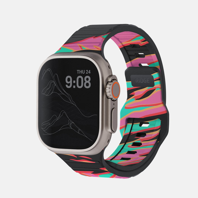 Everyday Watch Strap in Neon Tiger print on an Apple Watch Ultra, side angle showing buckle and vented band.